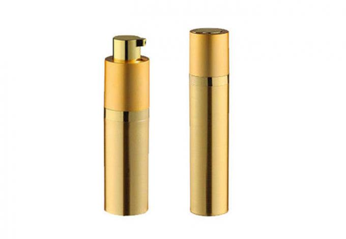 Bouteille cosmétique cylindrique d'or de pompe à vide